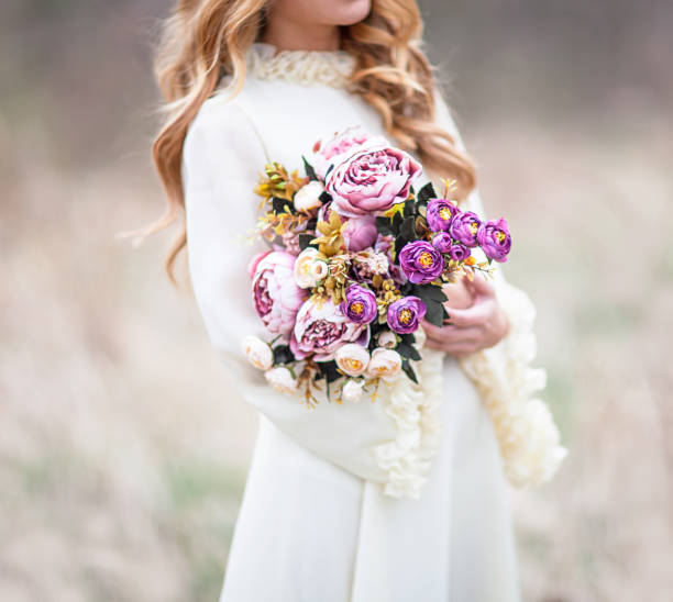 istock Young beautiful woman with flowers 656772824