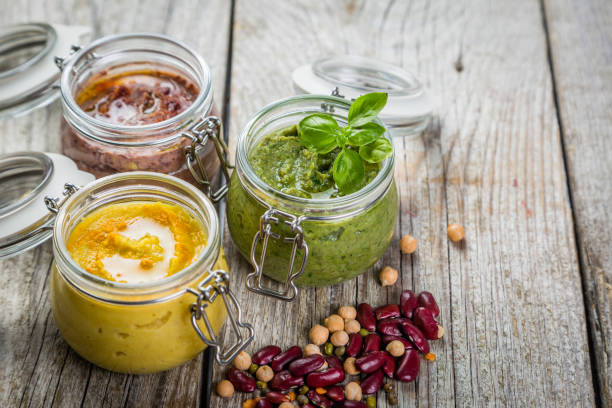 istock Selection of colorful hummus in jars 656781018