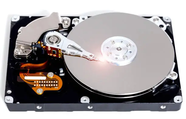 Photo of Open hard drive against white background