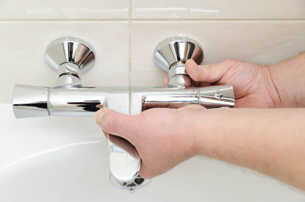 istock Installing faucet with thermostat. 656786600