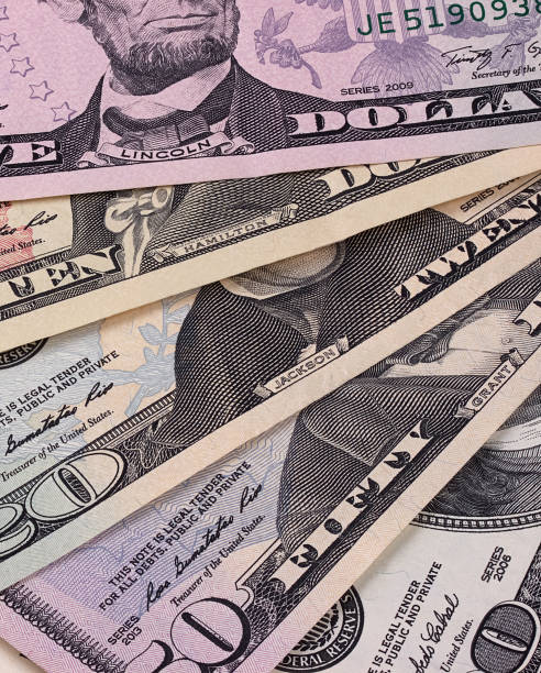 istock American dollar bills of different denominations abstract background. 656787102