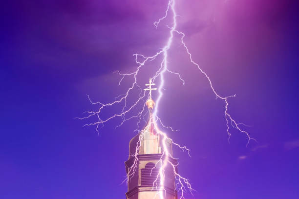 top of church tower with lightning top of church tower with lightning and blue and purple sky lightning tower stock pictures, royalty-free photos & images
