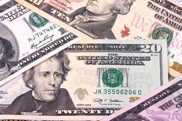 istock American dollar bills of different denominations abstract background. 656789894