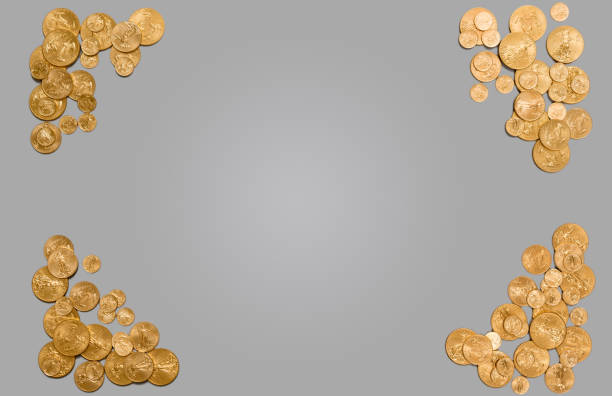 Pure gold coins forming edge of background Solid gold USA coins arranged around edge of plain grey background. Suitable for header image or concept for wealth or financial management golden nest egg taxes stock pictures, royalty-free photos & images