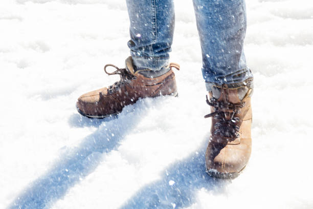istock mans legs and boots in the snow 656794596