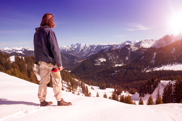 istock young man standing in the snow 656799840