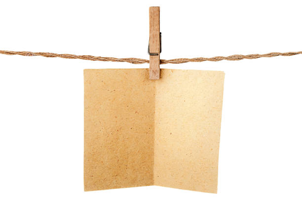 istock Piece old sheet of paper on clothespins 656801414