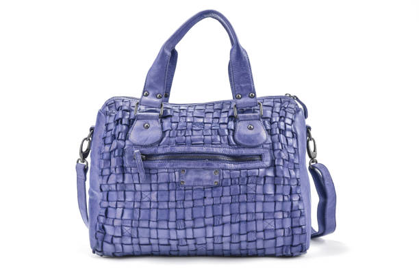 istock Elegant mauve handbag sewn from intertwined leather strips isolated on white background 656807582