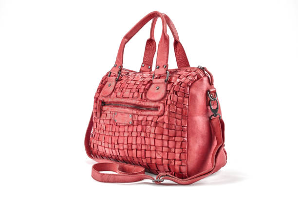 istock Elegant red  handbag sewn from intertwined leather strips isolated on white background 656807830