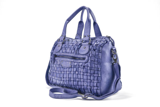 istock Elegant mauve handbag sewn from intertwined leather strips isolated on white background 656808152