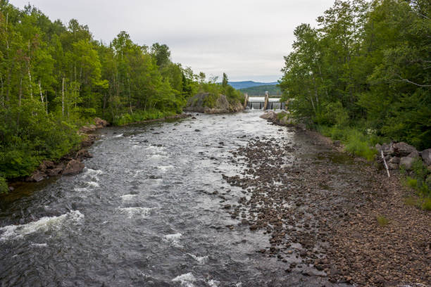 istock little river with dam at the end 656815414