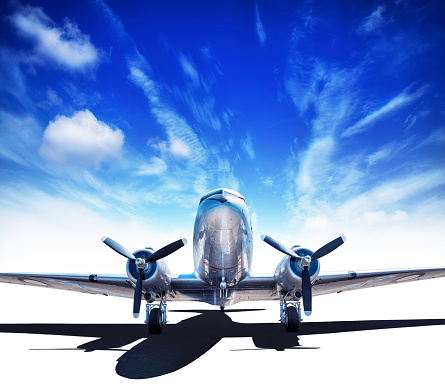 Photo of an airplane before taking off, pictured on the ground at the airport runway.