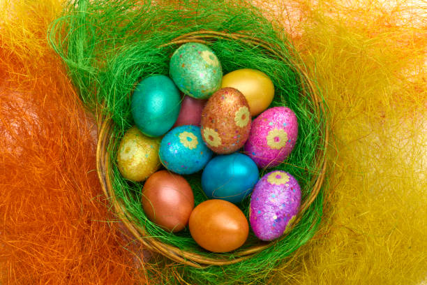 istock Happy Easter. Colorful Easter eggs in a basket on the artificial grass 656838594