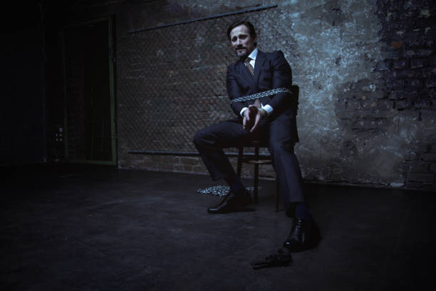 istock Kidnapped businessman making an attempt reaching a gun 656838608