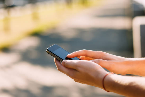 istock Close up of a man using mobile smartphone soft focus, video calls, holidays to work, using the Internet 656842156