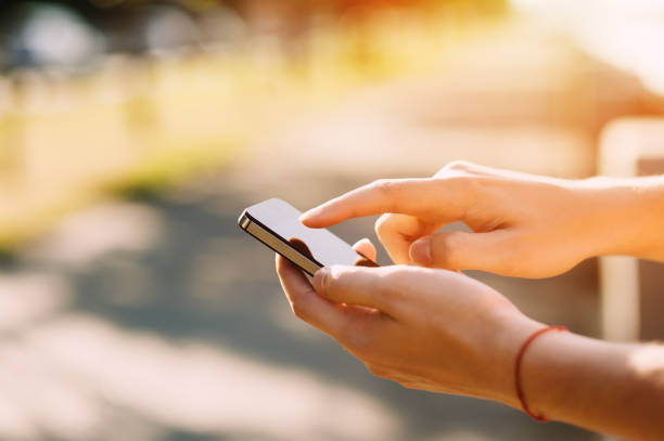 istock Close up of a man using mobile smartphone soft focus, video calls, holidays to work, using the Internet 656842160
