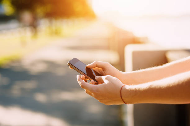 istock Close up of a man using mobile smartphone soft focus, video calls, holidays to work, using the Internet 656842162