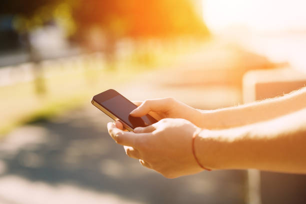 istock Close up of a man using mobile smartphone soft focus, video calls, holidays to work, using the Internet 656842168