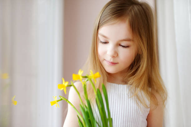 Girl smelling the scent of flowers