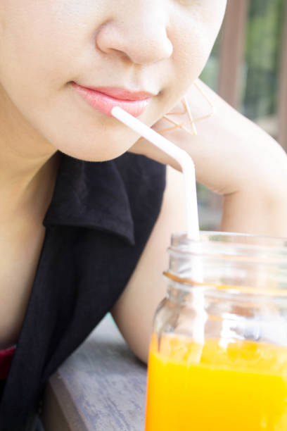 istock Woman drinking orange juice 656854864