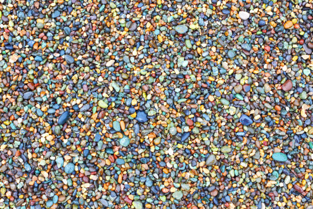 The texture and pattern of coastal pebbles closeup.