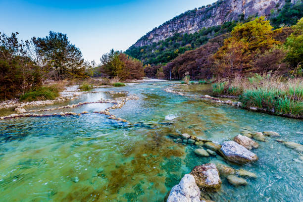 istock Fall foliage on the crystal clear Frio River in Texas. 656855474