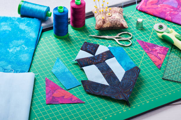 istock Sewing patchwork of block anchor surrounded by accessories 656855872