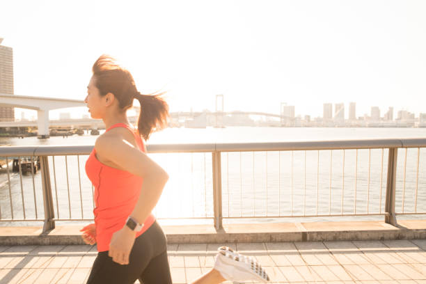 istock A young woman running on a city road 656855882