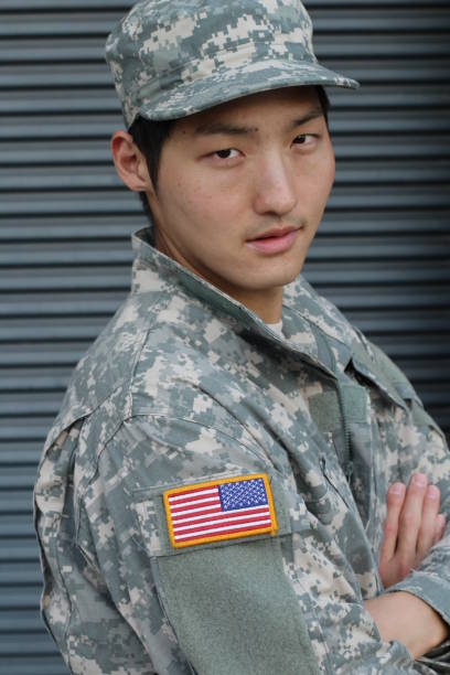 istock Army Asian male isolated on gray background 656858154