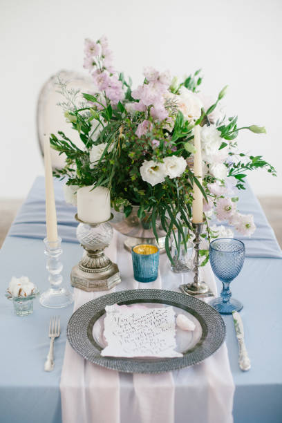 istock Silver candlestick and other elements of festive table wedding decorations. 656858844