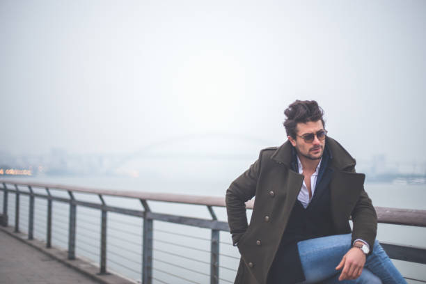 istock Gentleman sitting by the lake 656861764