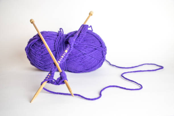 Woman holding woollen yarn balls. Hand made.
