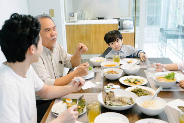 istock Multi-generation family eating in the kitchen 656864358