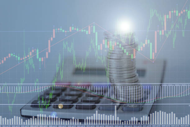 istock Double exposure of financial graph chart and rows of coins with calculator 656864572