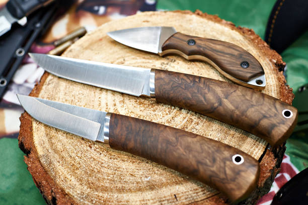 istock Hunting knives on wooden log 656873150