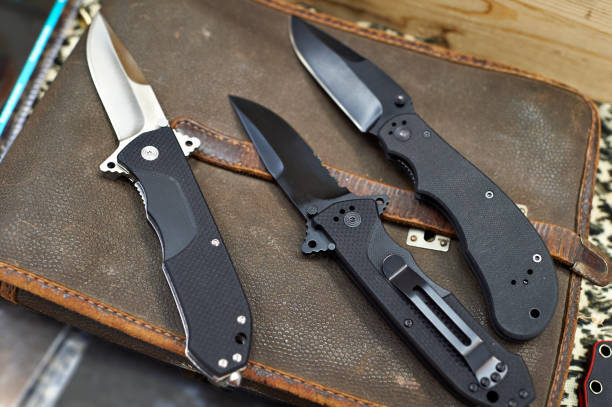 istock Folding knives on leather retro bag tablet in rarity store 656873256