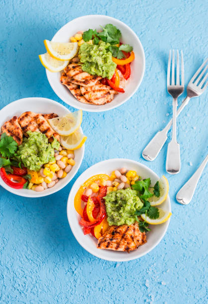 istock Grilled chicken fajitas bowls on a blue background, top view. Flat lay 656873366