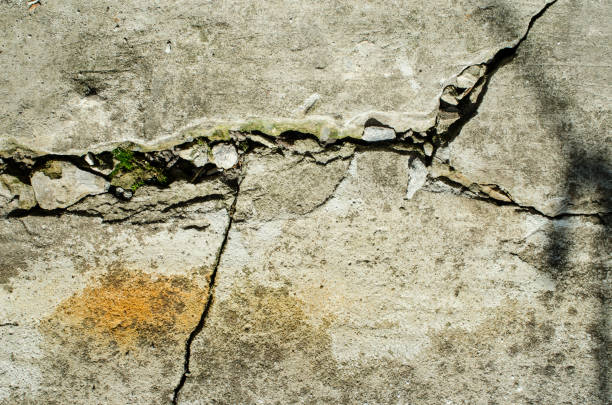istock the crack in the concrete wall, background. 656876138