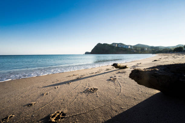 Rocks, the fishing boat and sea stock photo