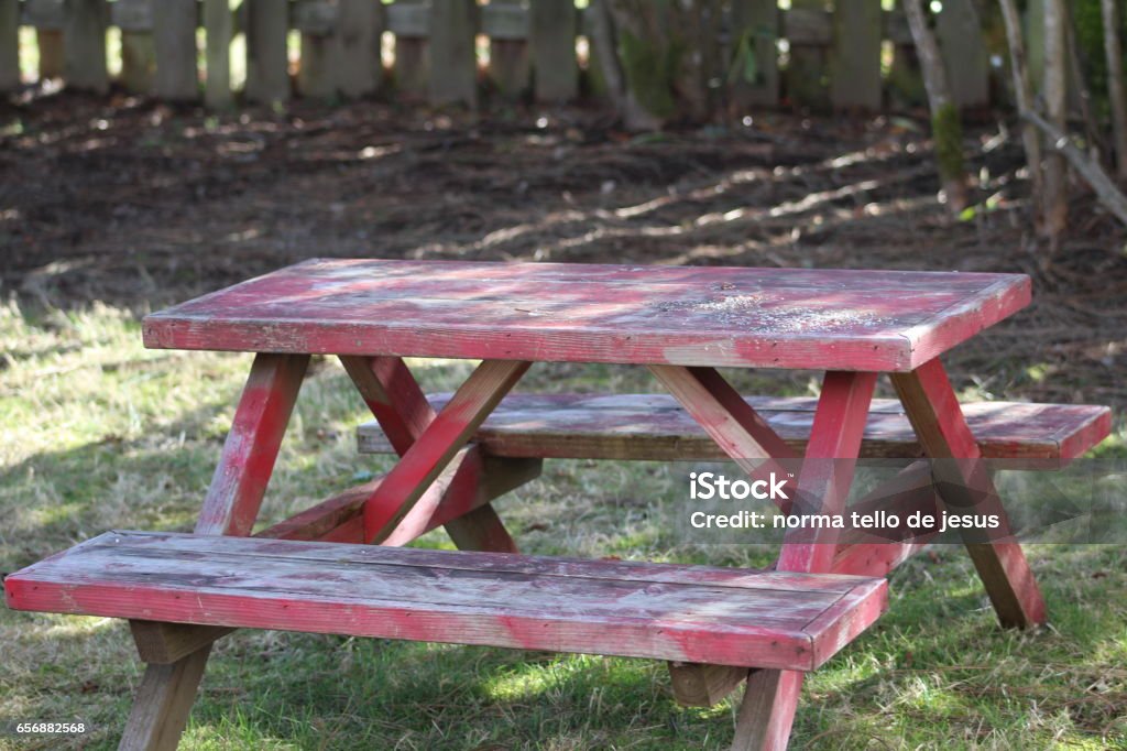 Red picnic table Out doors picnic tables summer time Bright Stock Photo