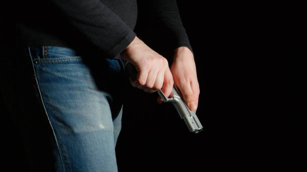 istock Danger man reload a pistol 656886228