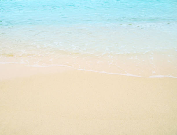 istock Soft wave of blue ocean on sandy beach. Background. 656888616