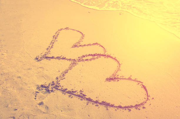 istock couple heart on sand beach , love 656899436