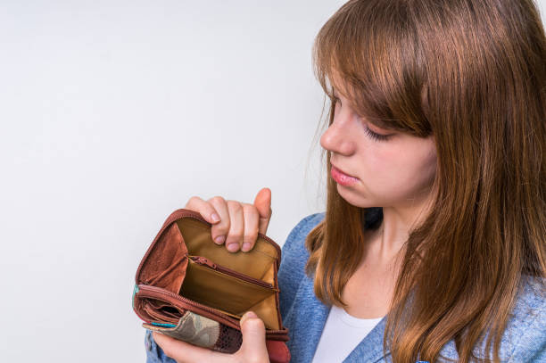 istock Woman holding an empty wallet, she hasn't money 656909182