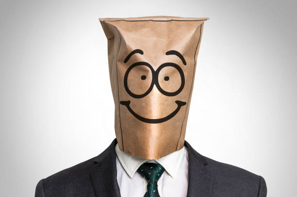 istock Businessman with a bag on the head - with smile face 656909220