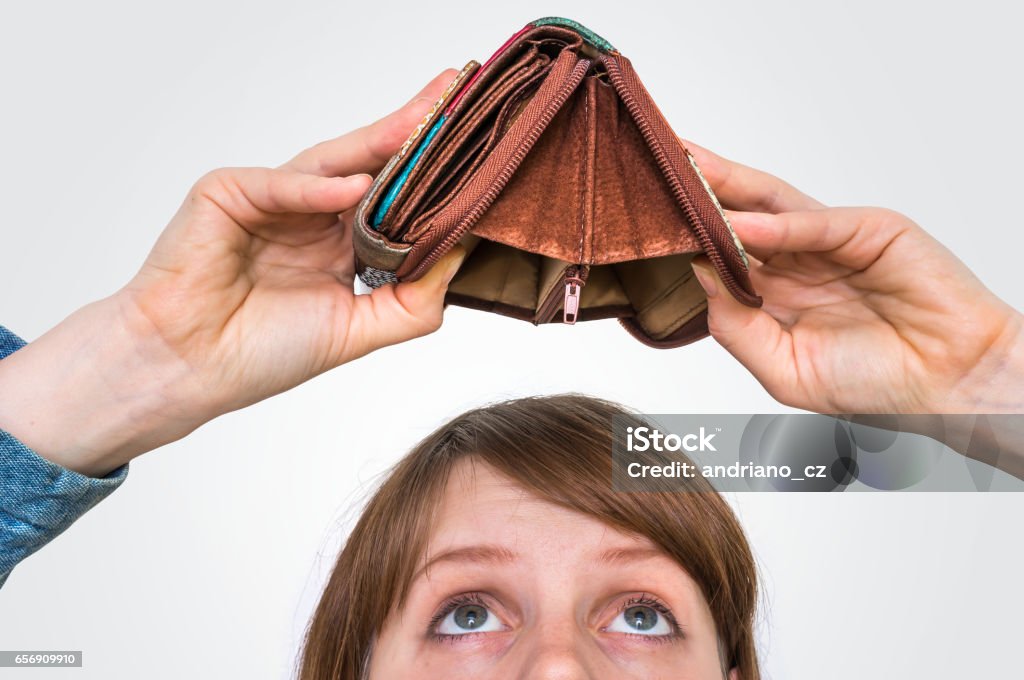 Woman holding an empty wallet, she hasn't money Business woman holding an empty wallet, she hasn't money Empty Wallet Stock Photo