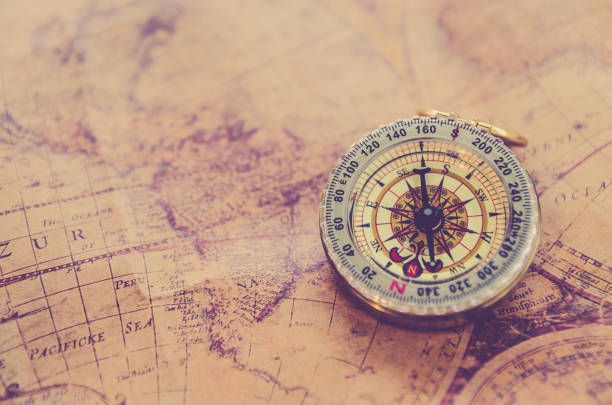 istock Old vintage retro golden compass on ancient map 656915348