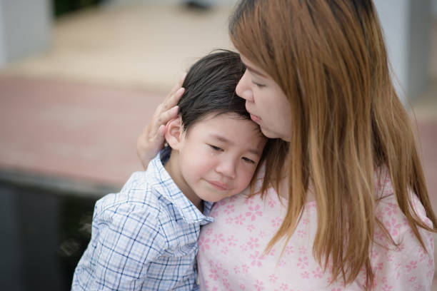istock Mother embracing and consoling her son 656915798