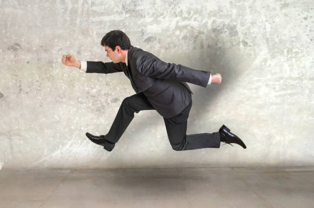 istock Small businessman running away 656916110