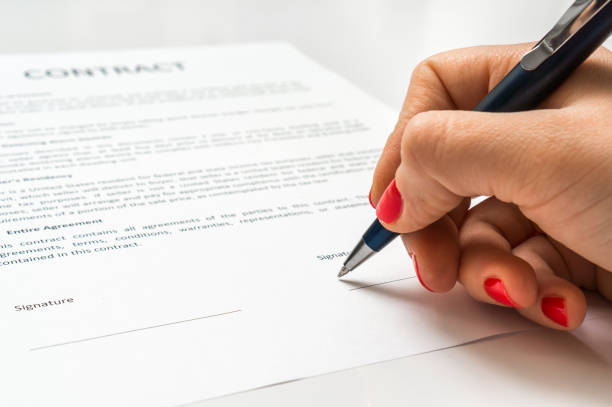 istock Business woman signing contract document in office 656919380